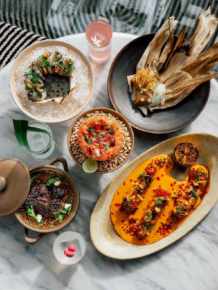 A table with different dishes AI-generated content may be incorrect.