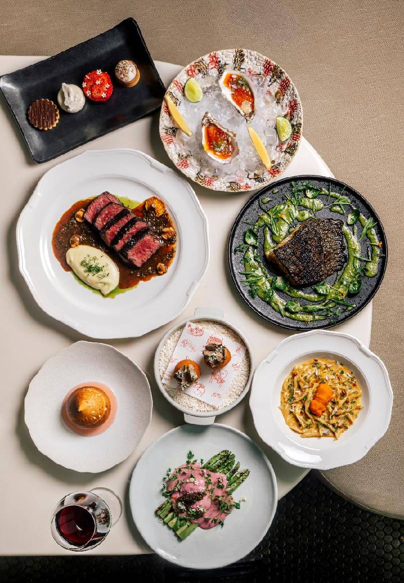 A table with plates of food AI-generated content may be incorrect.